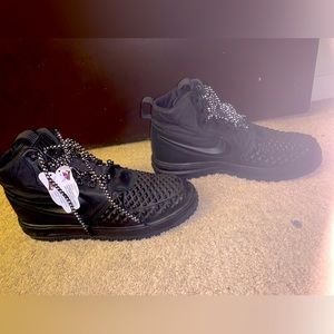A pair of oh Nike lunar force. Duck boots size 10